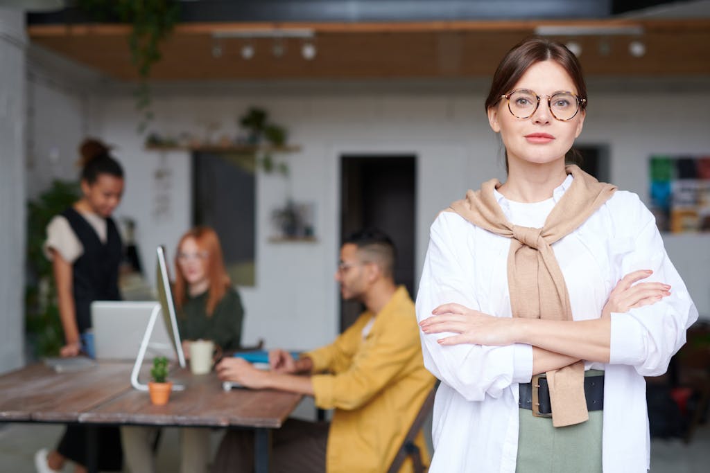 Confident businesswoman in a modern office space, embodying success and leadership.